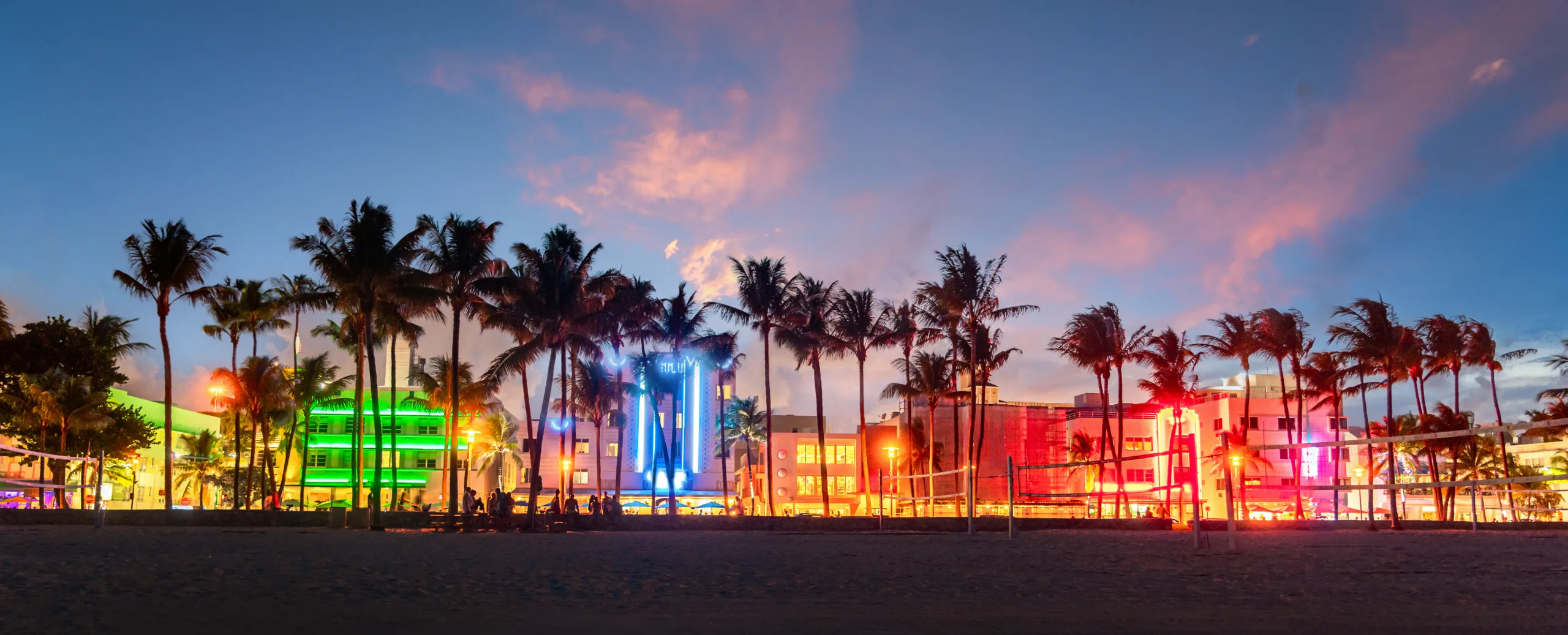 Dynamic nightlife scene with people dancing at a club in Miami Beach, a city known for its vibrant night entertainment.